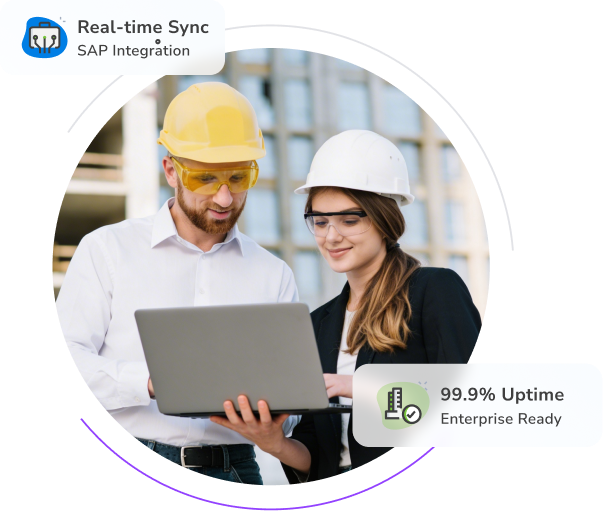 Two manufacturing professionals reviewing data on a laptop, representing real-time SAP integration and system uptime.